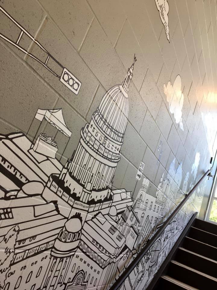 Madison capital Graphics banner on wall
