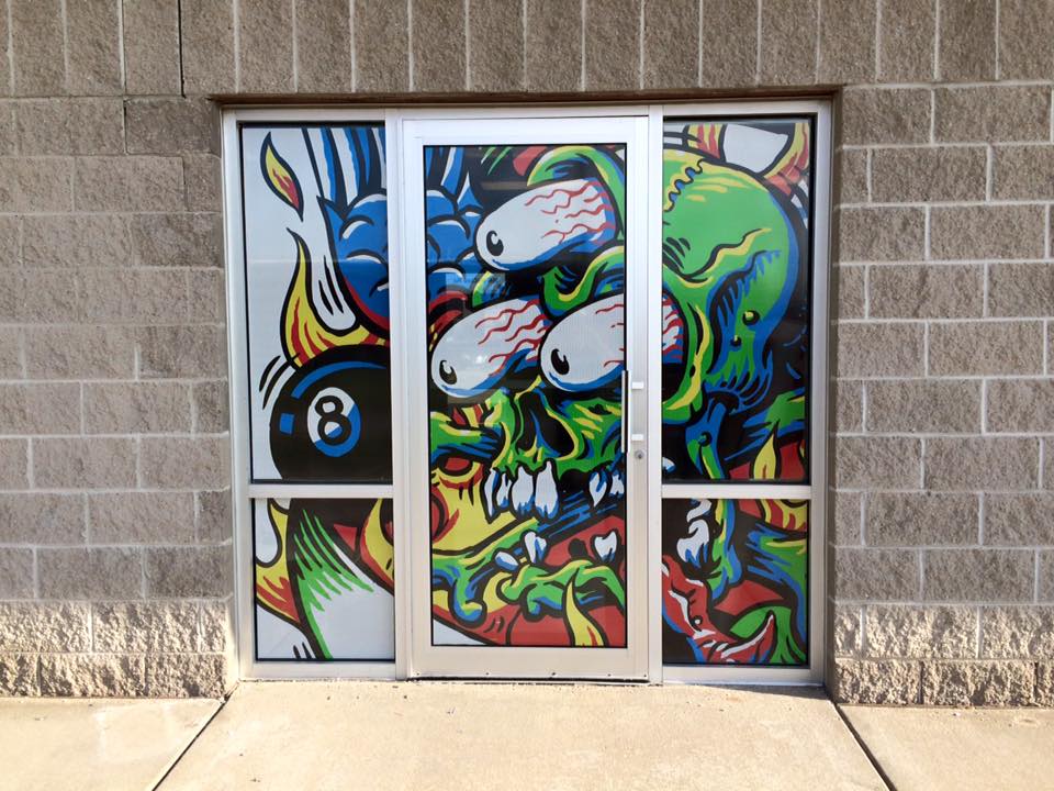 Glass film banner of a three eyed crazy character