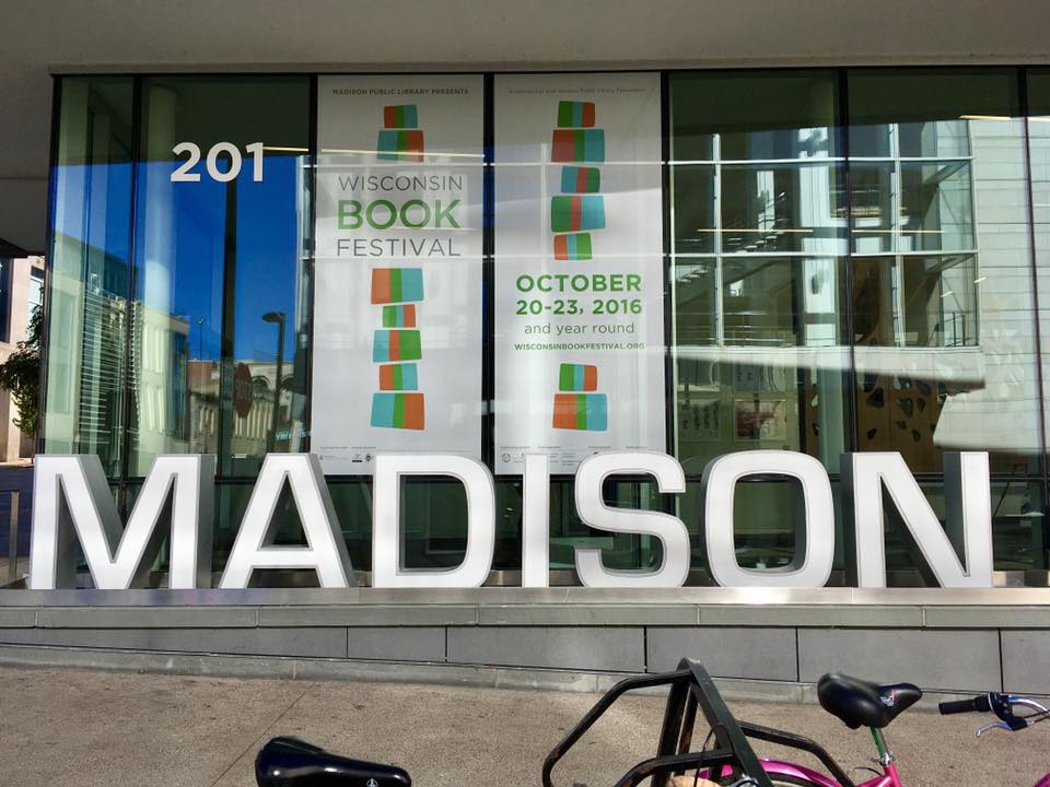 Graphics banner on glass window for Wisconsin Book Festival in Madison