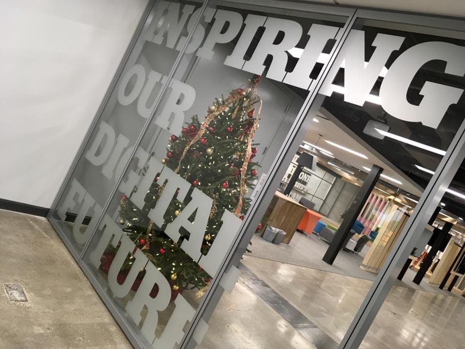 Glass film banner looking into the hallway with the saying 