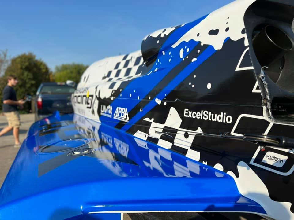 Racing Car with blue, white and black graphic design wrap