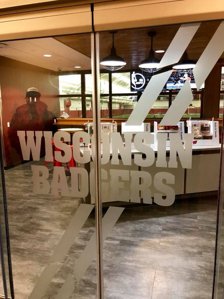 Glass film banner on opening sliding doors of Wisconsin Badgers
