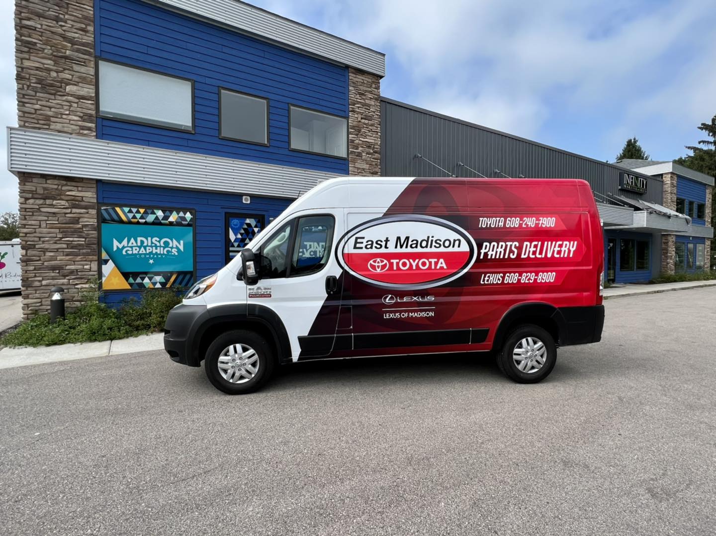 East Madison company van Patio pleasures van with Fleet Graphics Vehicle wrap designed by Madison Graphics Company parked in front of the design building