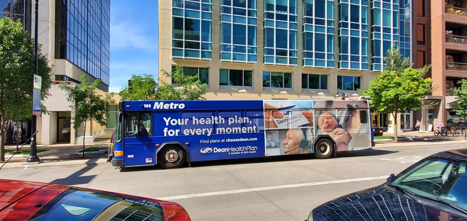 Dean Health plan Bus Fleet Graphics promoting their business on the metro bus