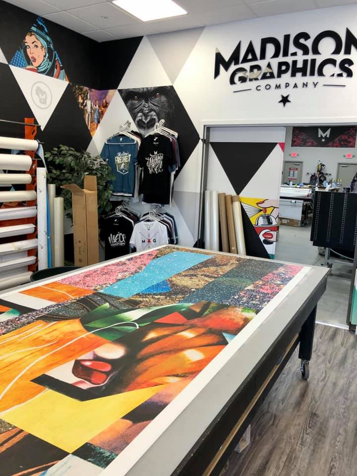 Graphics banner on table in the design room for Madison Graphics Company