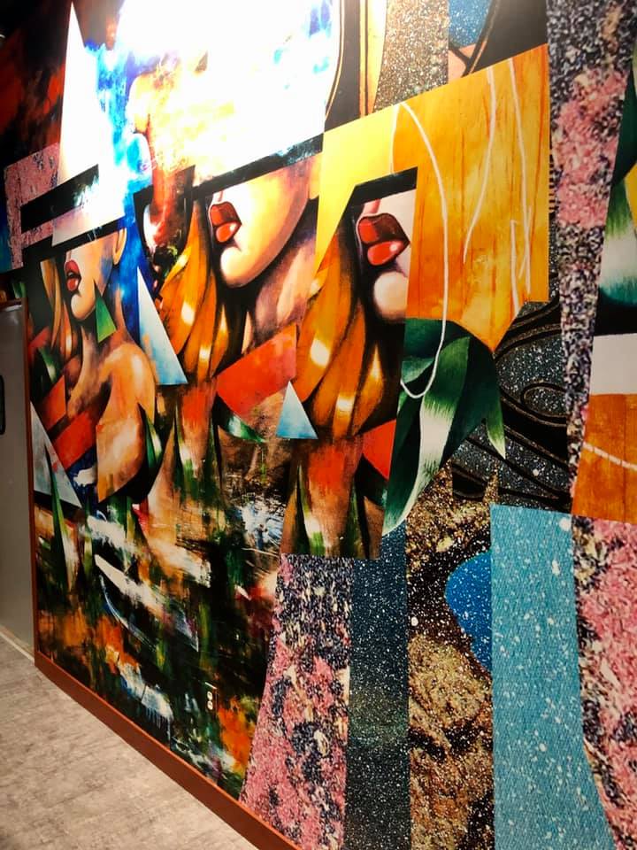 Abstract colorful collage with lips of a woman as a banner on wall
