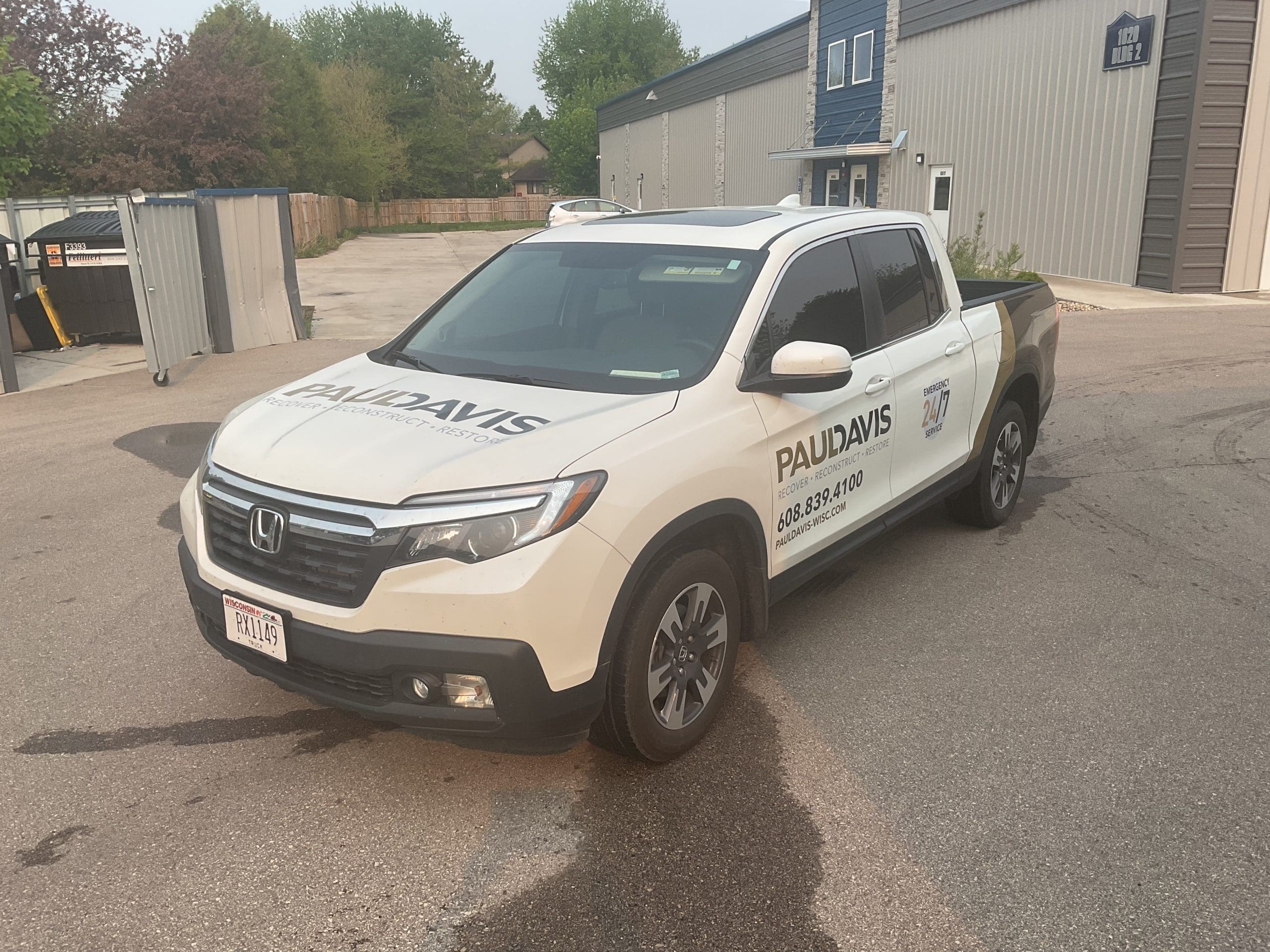 Paul David company truck with Fleet Graphics Vehicle wrap designed by Madison Graphics Company
