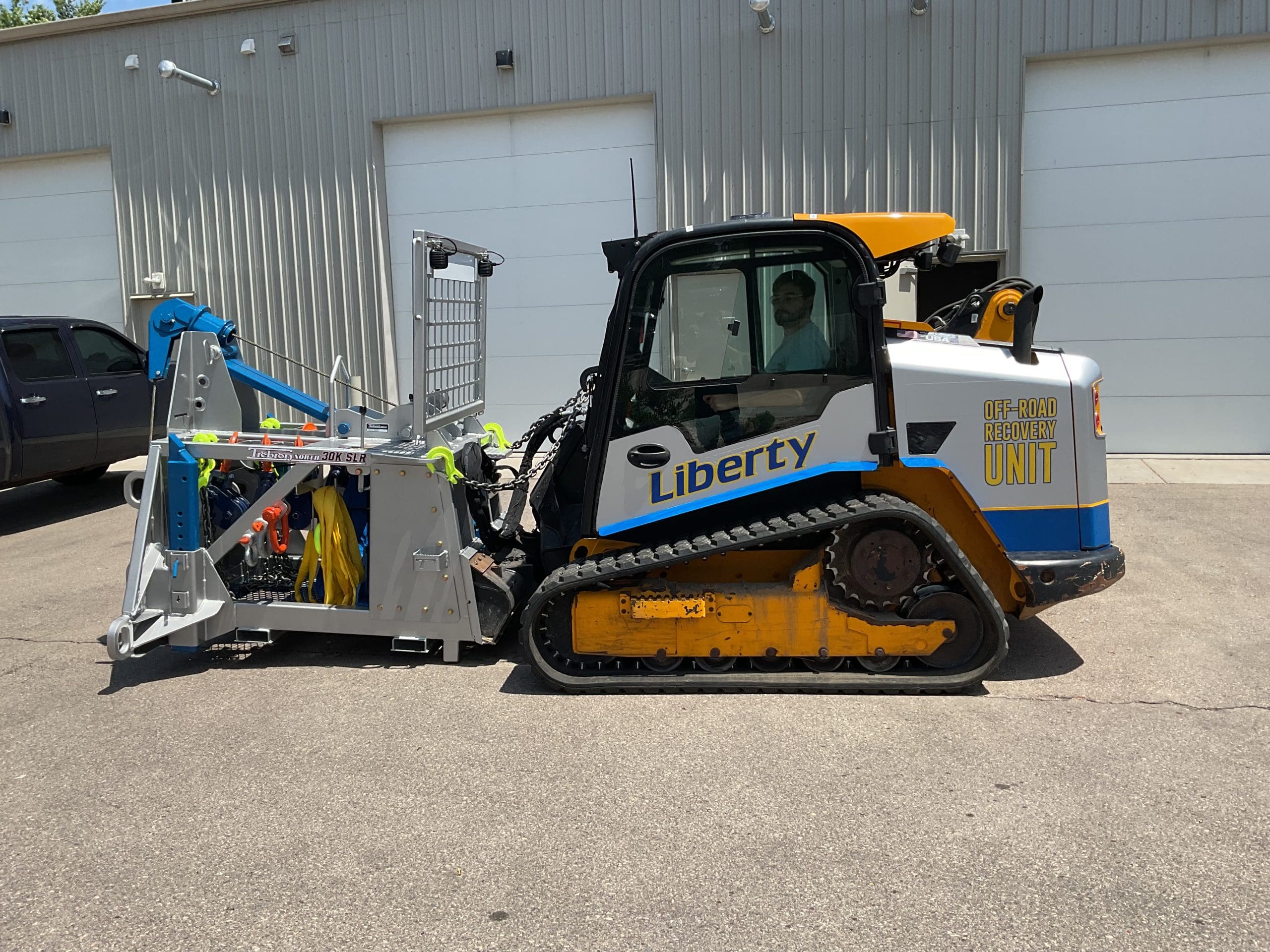 Liberty Towing Services off road recovery unit track skid steer with printed graphics