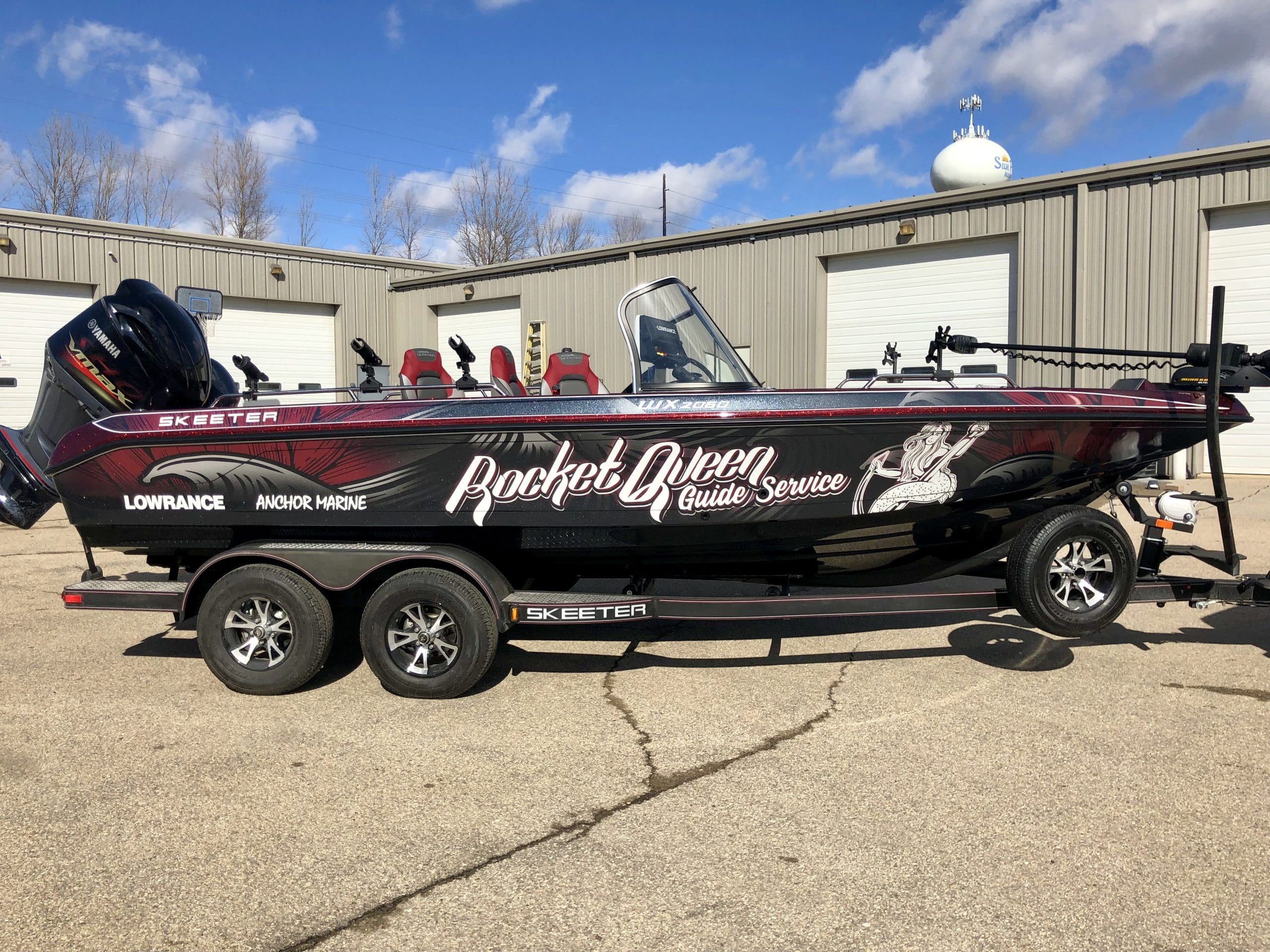 Rocket Queen Guide Service boat with red and black wrap designed by Madison Graphics Company