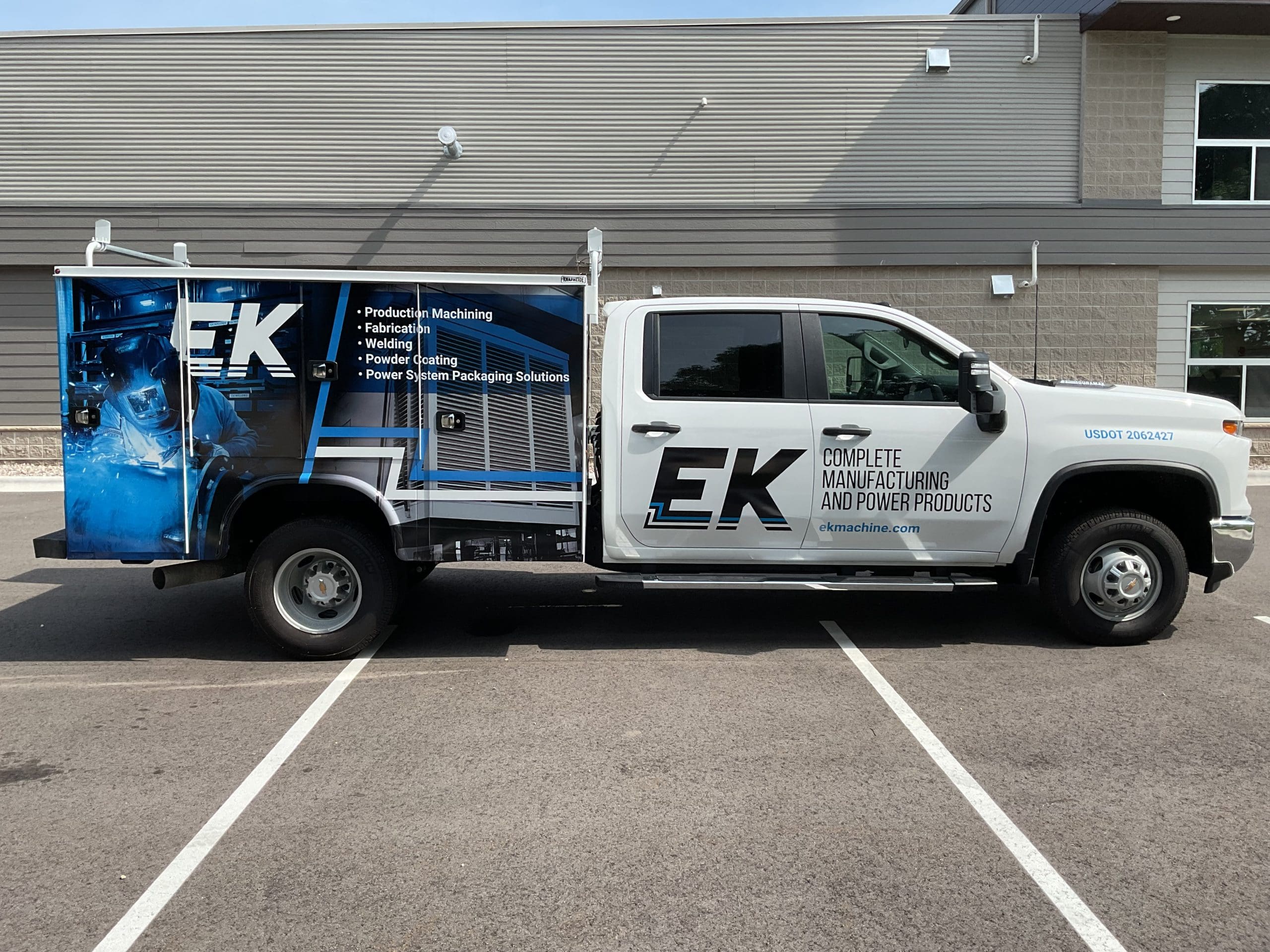 EK Company van with Fleet Graphics Vehicle wrap designed by Madison Graphics Company