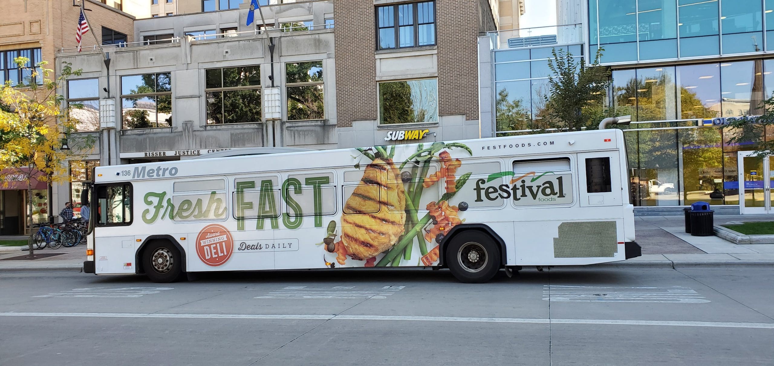 Fresh Fast Banner on Bus Fleet Graphics promoting Festival Foods Grocery mart