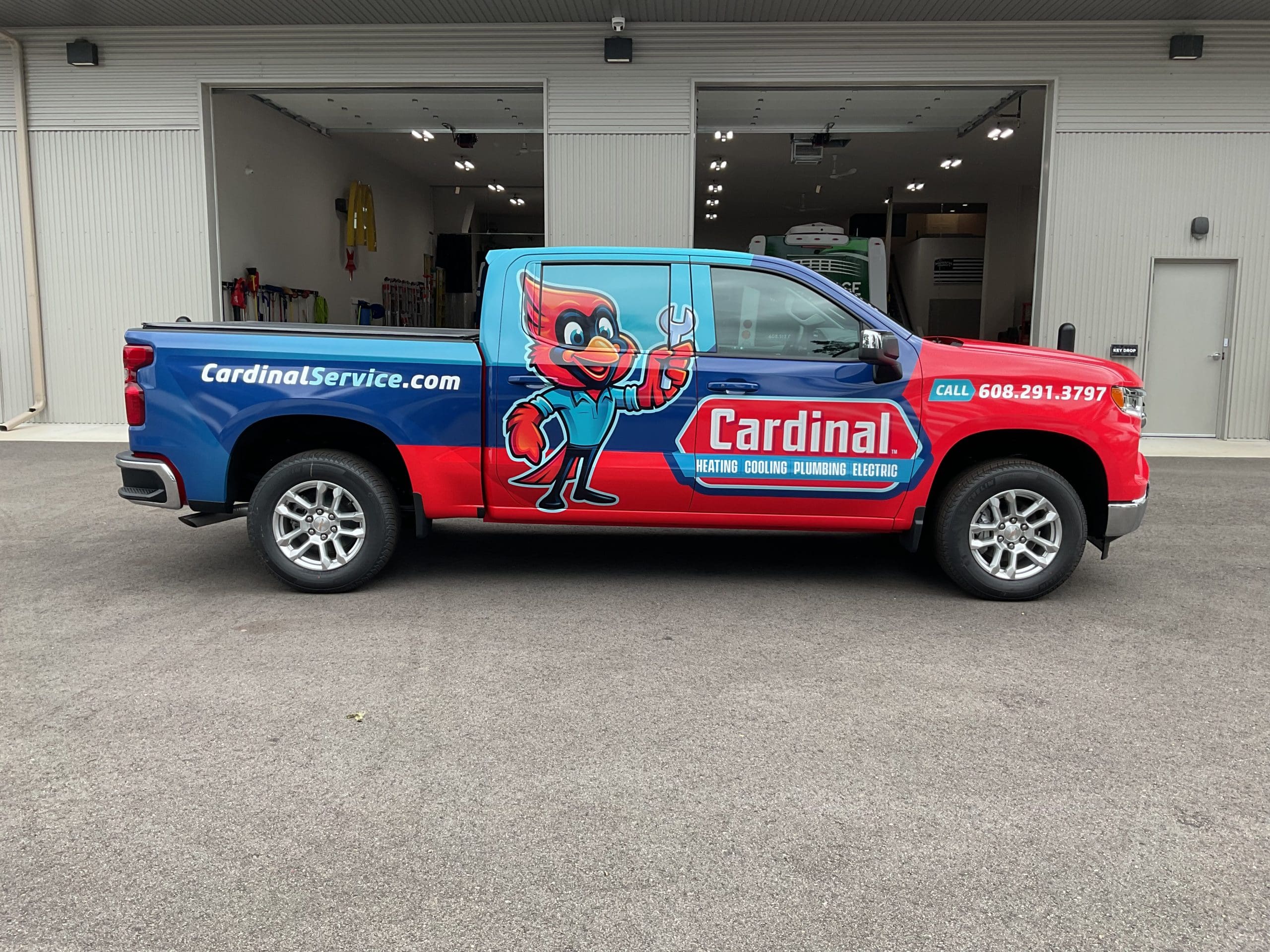 Cardinal plumbing company truck with cartoon Fleet Graphics Vehicle wrap designed by Madison Graphics Company