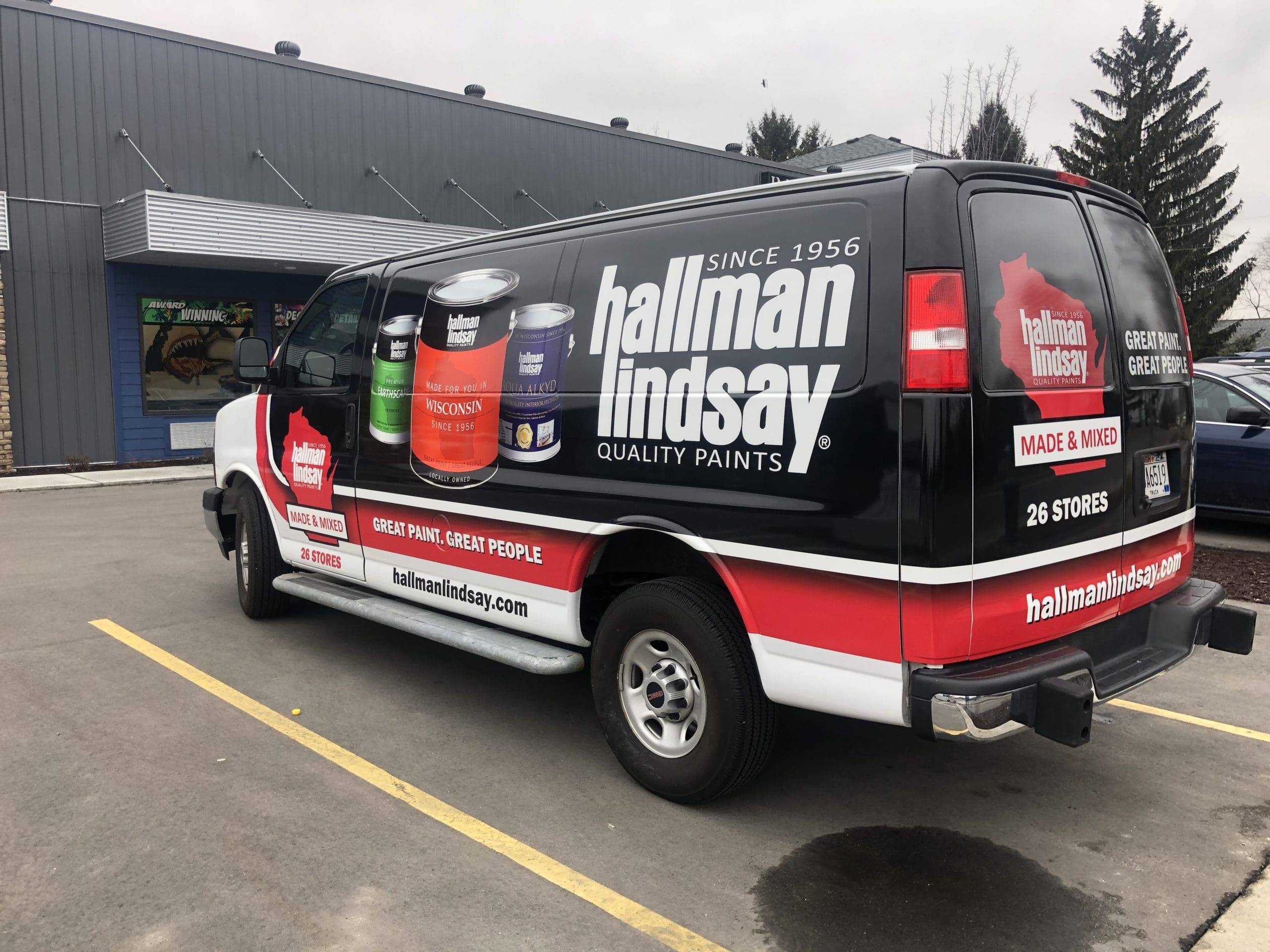 Hallman Lindsay company van with Fleet Graphics Vehicle wrap designed by Madison Graphics Company
