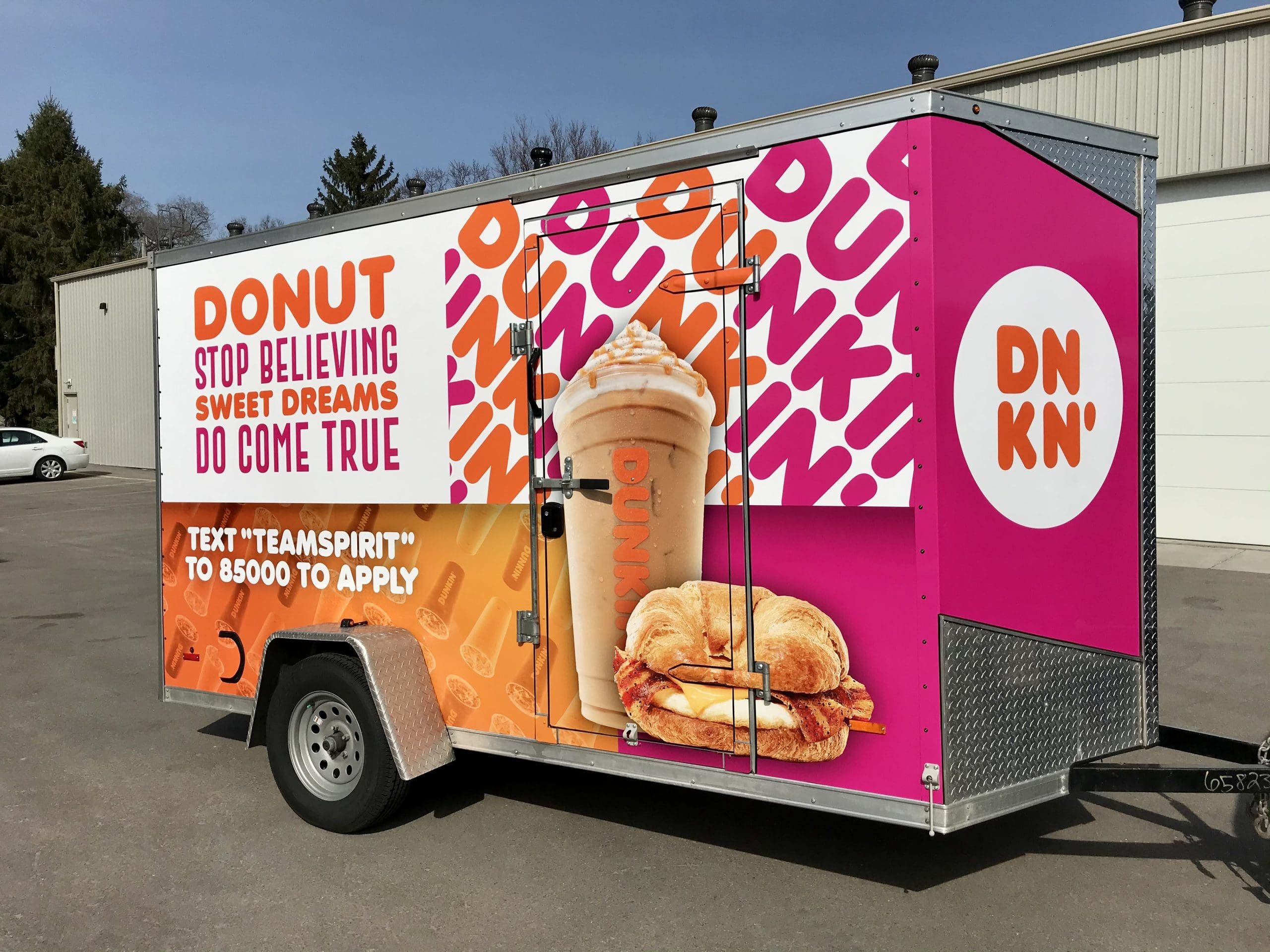 Dunkin Donuts design on a trailer with Fleet Graphics Vehicle wrap designed by Madison Graphics Company