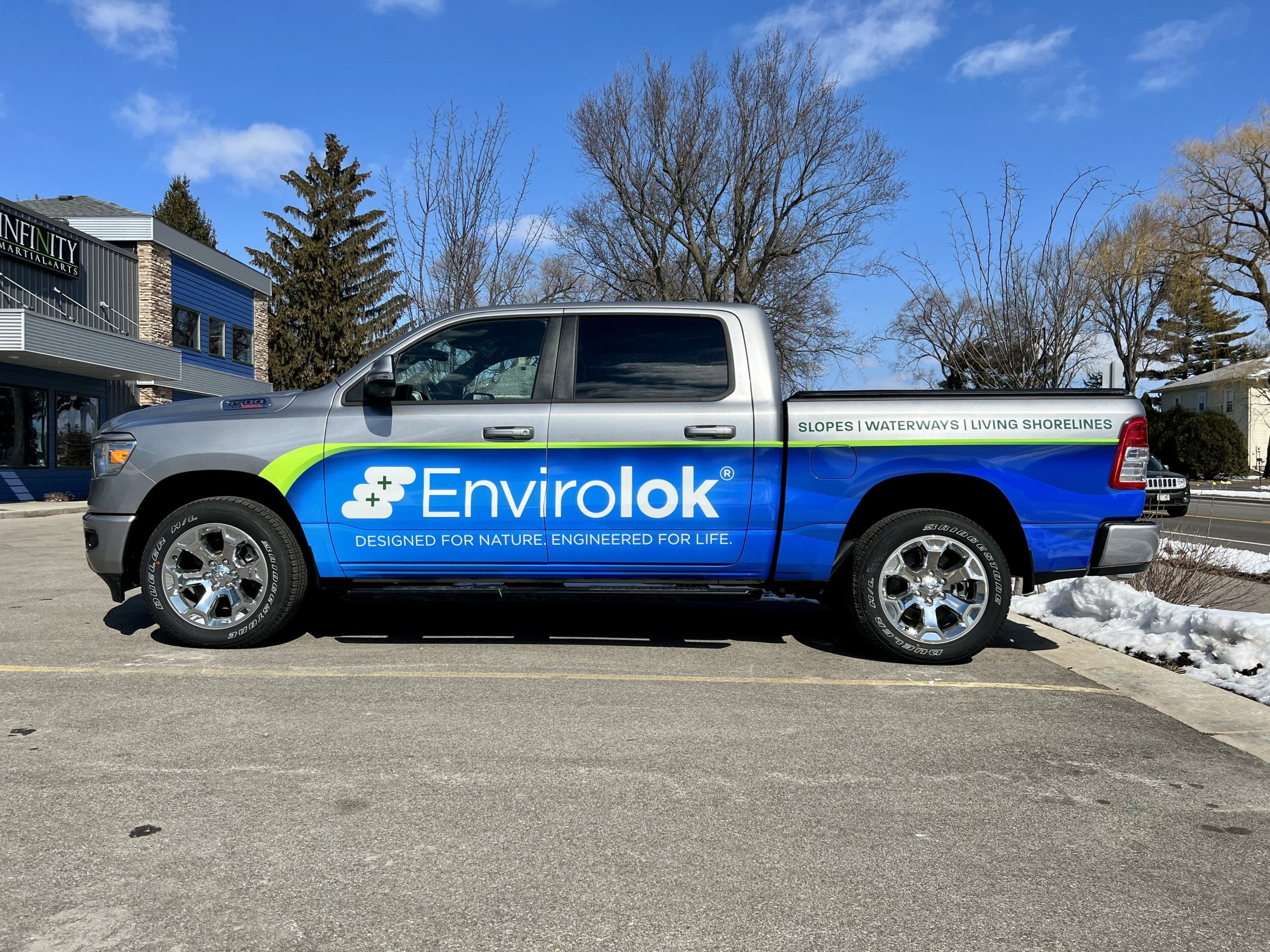 Envirolok truck with Fleet Graphics Vehicle wrap designed by Madison Graphics Company