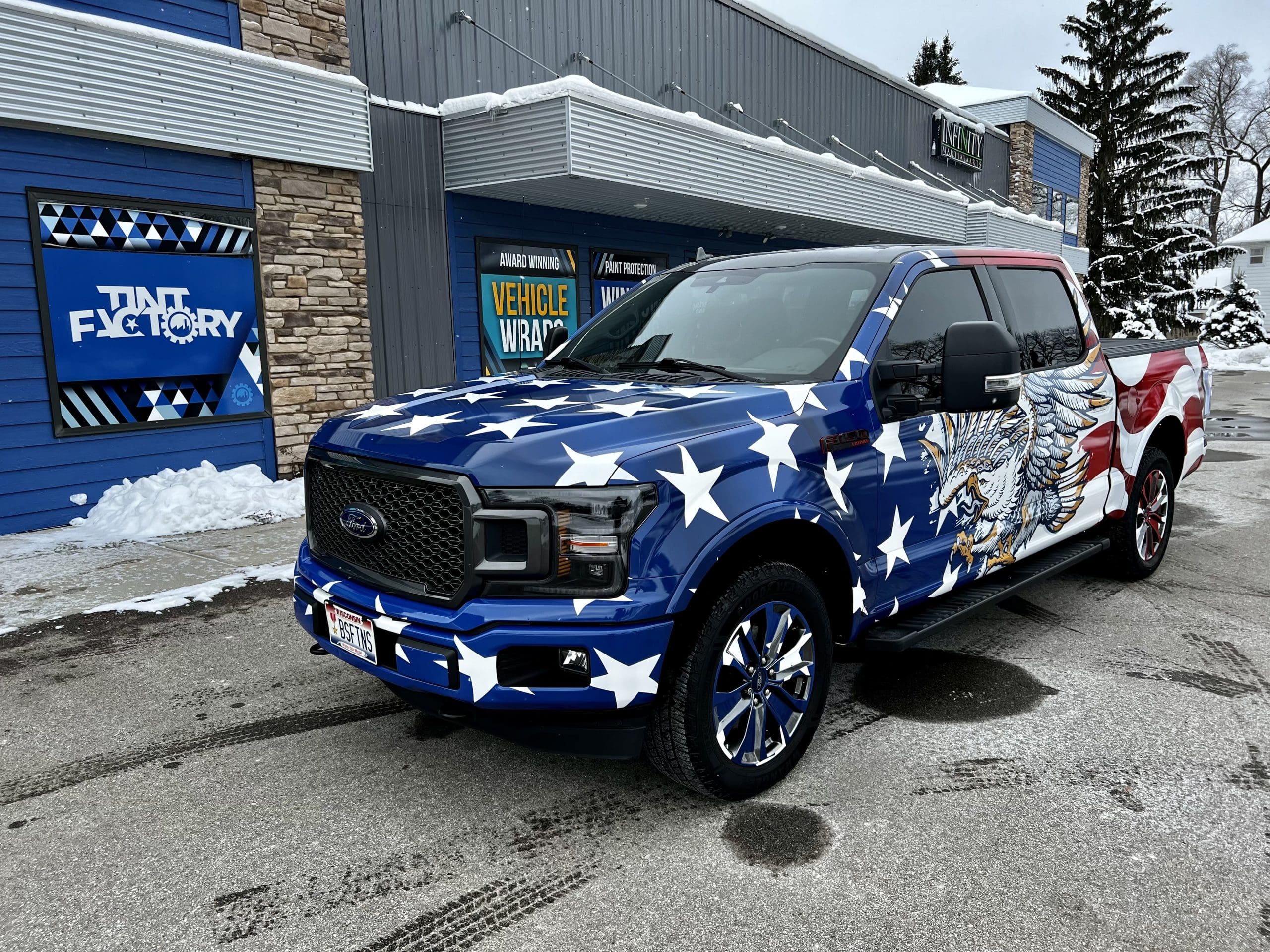 American eagle and flag graphics on a company truck with Fleet Graphics Vehicle wrap designed by Madison Graphics Company