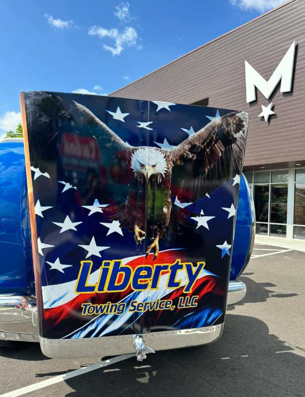 Liberty Towing Service Vehicle Wrap of a Eagle flying forward in front of an American flag