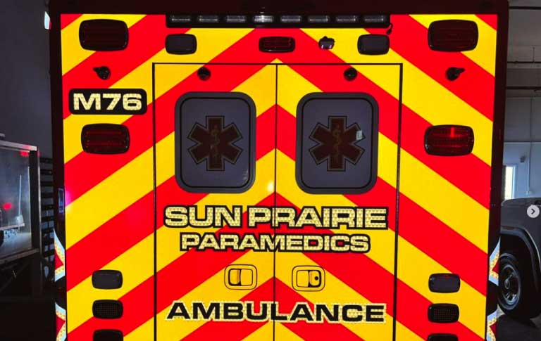 Sun Prairie Paramedics back of the ambulance showing bright orange and yellow graphics