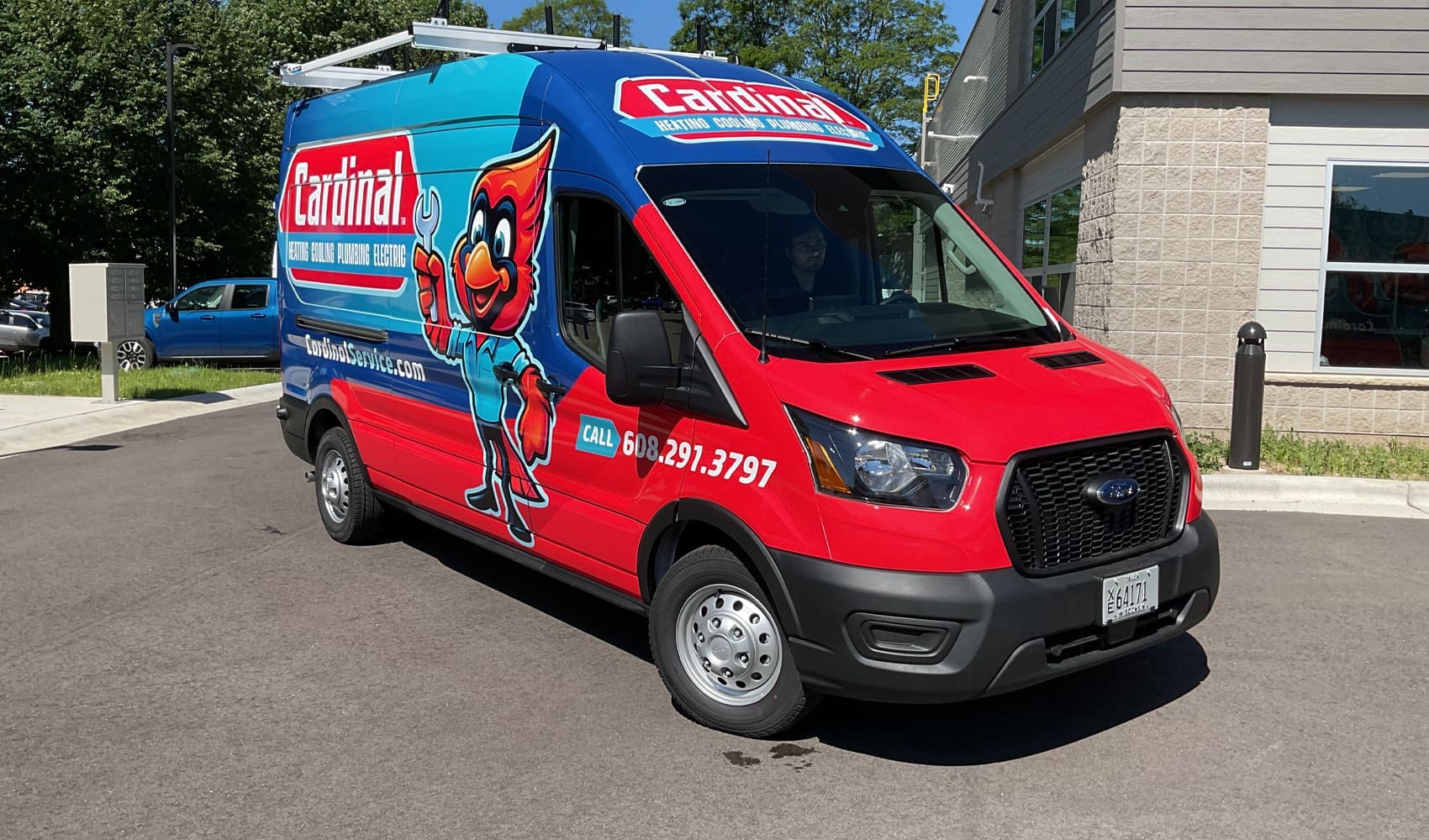 Cardinal Plumbing Fleet Graphics Vehicle wrap with a cartoon cardinal plumber holding a wrench designed by Madison Graphics Company